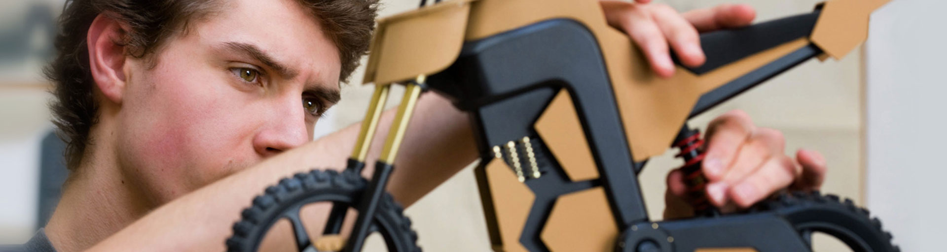 male student working on equipment