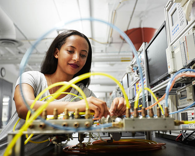student working on a electrical board