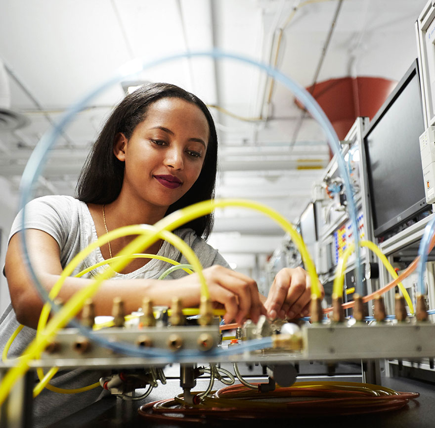 student working on a electrical board