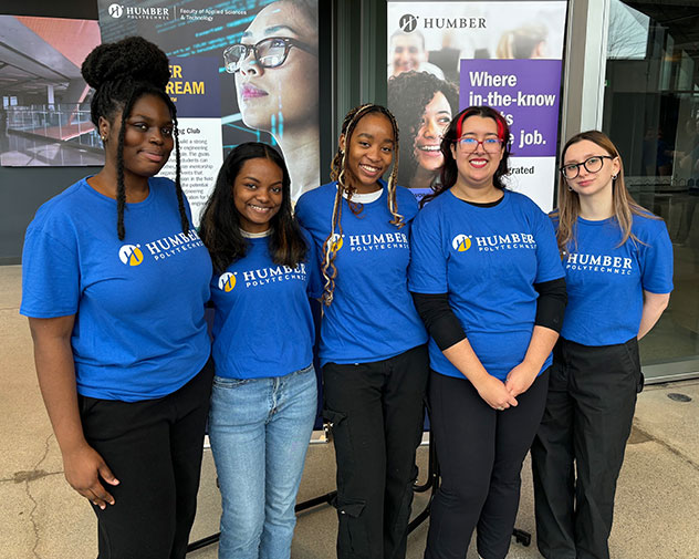five students smiling