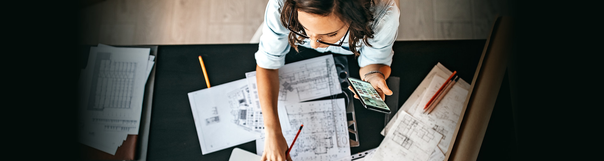woman looking at floor plans