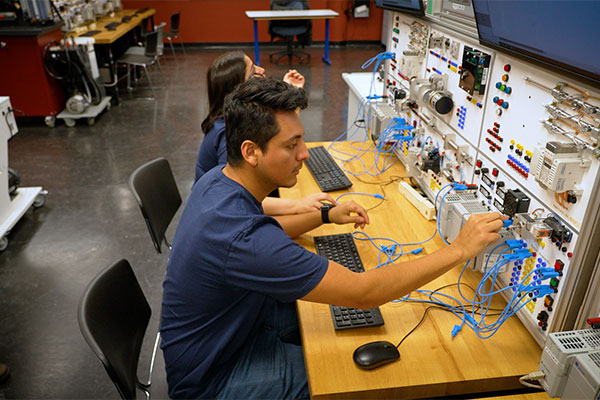 Students working on a electrical board