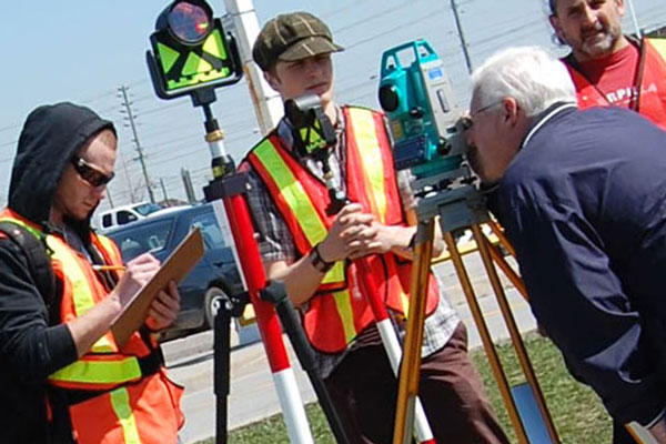 students watching teacher using building survey technology