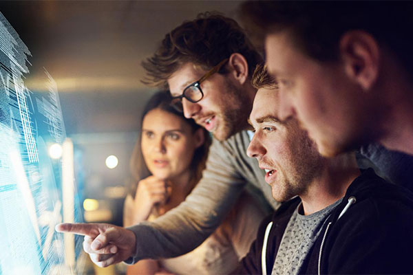 Group of People looking at computer screen