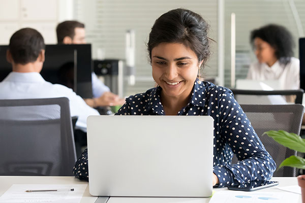 person working on laptop smiling