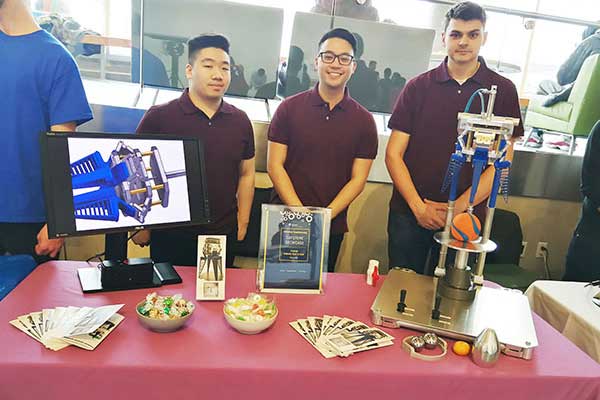 Students with Capstone project display