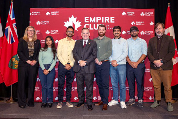 students meet a member of parliament at the empire club