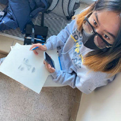 Architecture student drawing inspiration from campus life