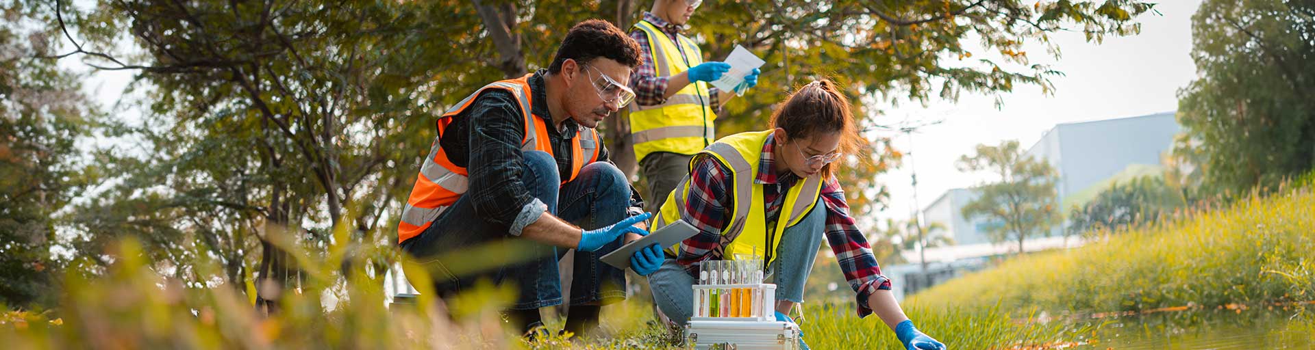 students doing work with chemicals on grass