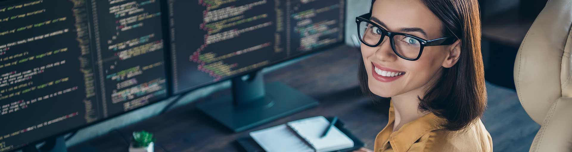 female working at computer programming