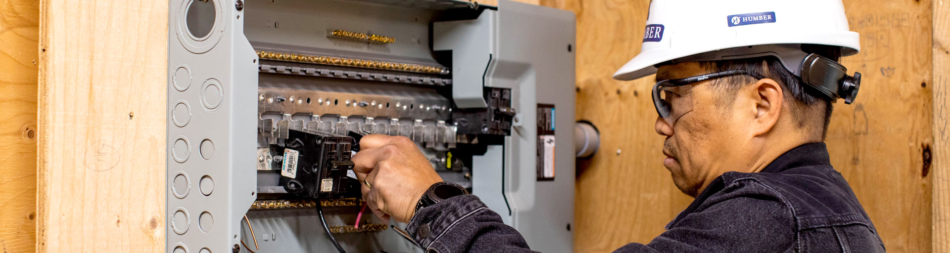 Person working in electrical panel