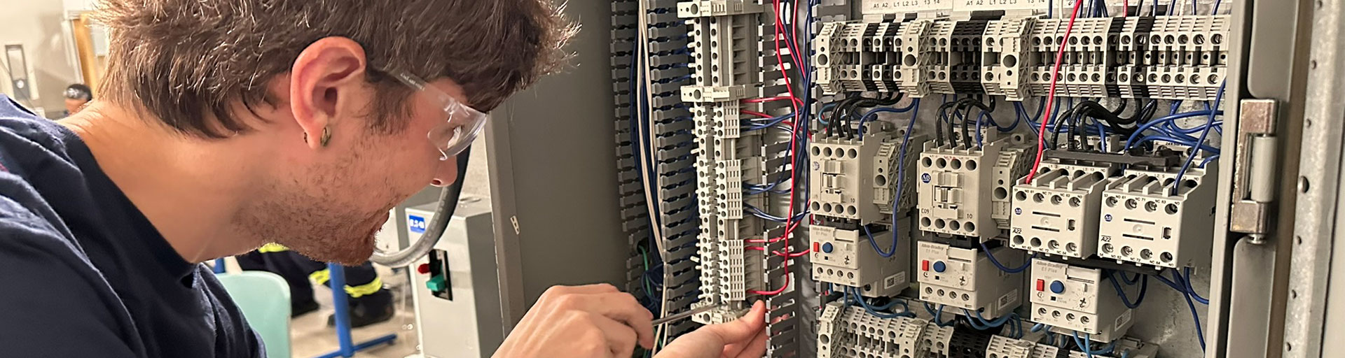 Person working in electrical panel