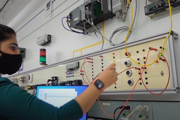student working on a electrical board