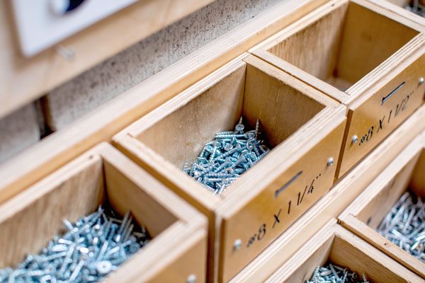 Boxes of screws in workshop