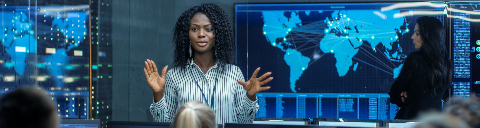Person standing in front of people talking