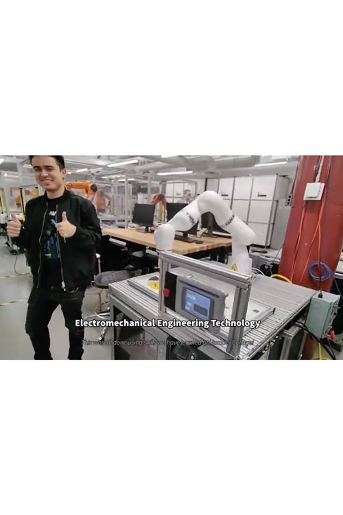 person giving thumbs up next to a robot arm