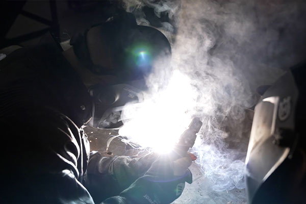 person doing soldering