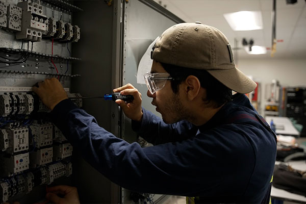 Person working on a fuse box