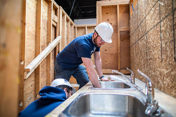 Person installing a sink