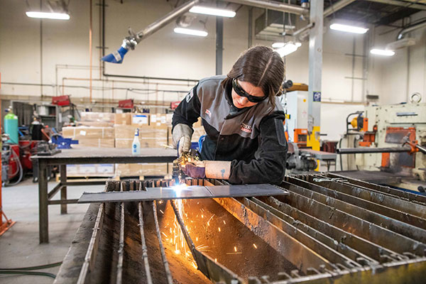 Person cutting metal